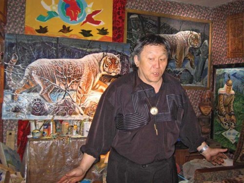 Полосатая кошка, пятнистая кошка Полосатая кошка, пятнистая кошка